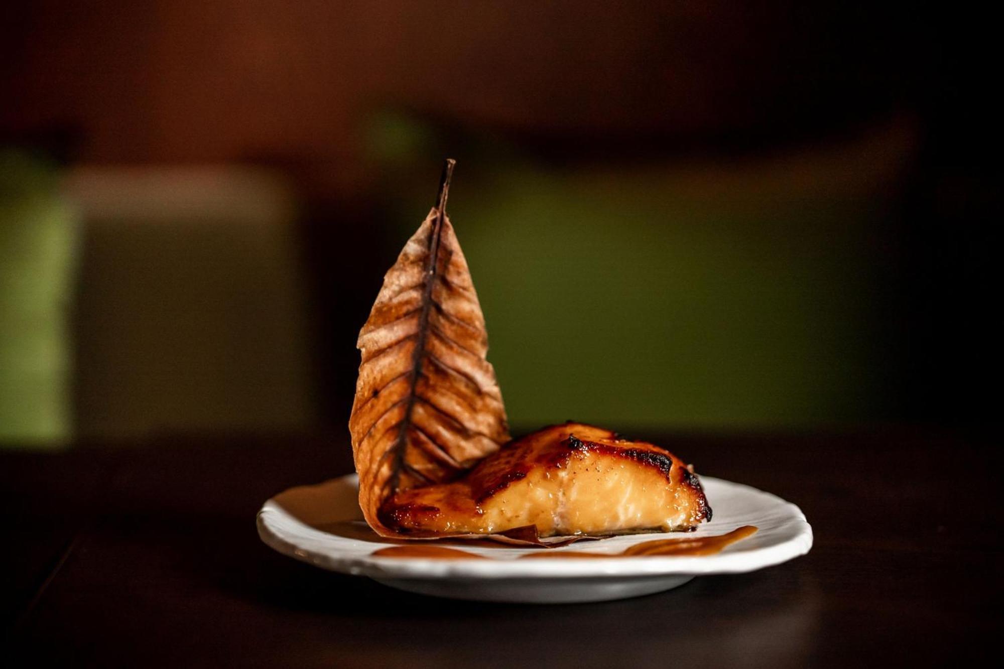 The Dubai Edition Kültér fotó Smoked and grilled salmon