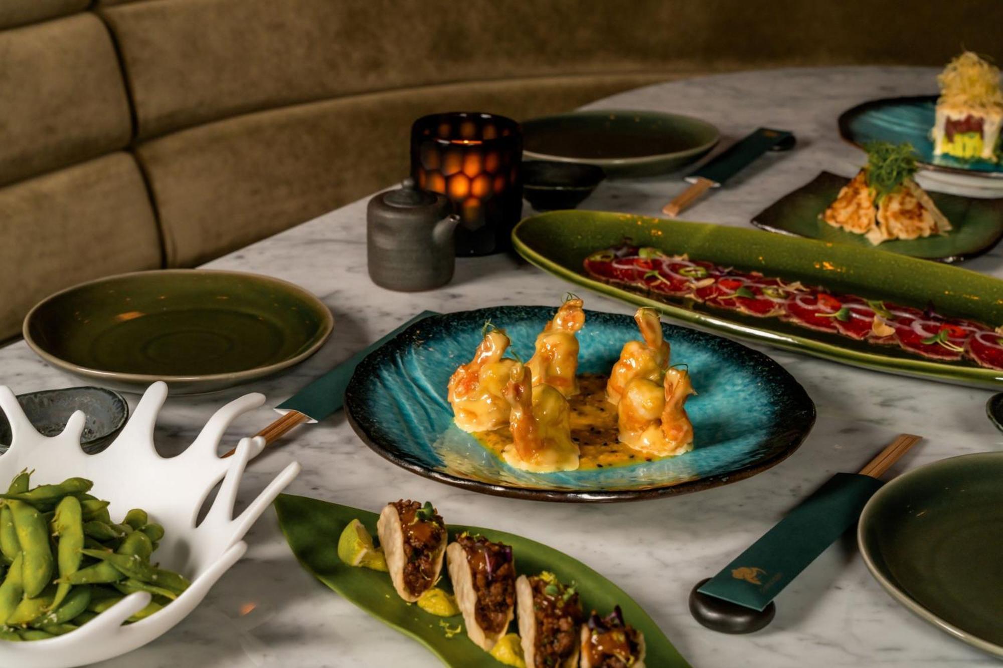 The Dubai Edition Kültér fotó A selection of dishes at the restaurant