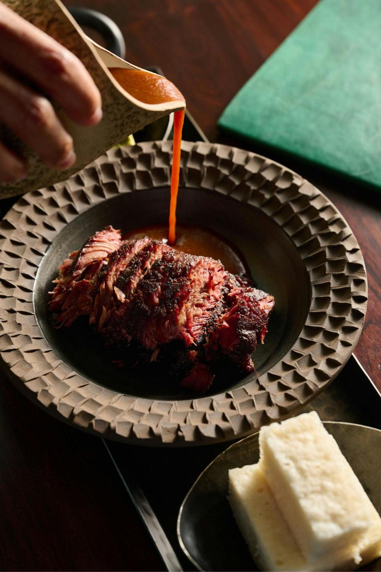 The Dubai Edition Kültér fotó A plate of grilled meat
